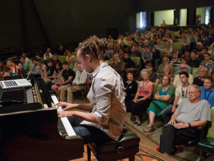 "How to Listen Like a Musician," presented by pianist Gerald Clayton, at the 2013 Port Townsend Jazz Workshop. Who is the drummer listening to? What kind of mood is the trumpet player in? Gerald Clayton will help you "open your ears" and identify as many details inside the music as possible.