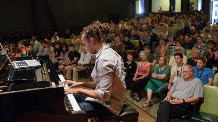 "How to Listen Like a Musician," presented by pianist Gerald Clayton, at the 2013 Port Townsend Jazz Workshop. Who is the drummer listening to? What kind of mood is the trumpet player in? Gerald Clayton will help you "open your ears" and identify as many details inside the music as possible.