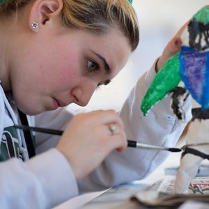 young artist paints in Port Townsend