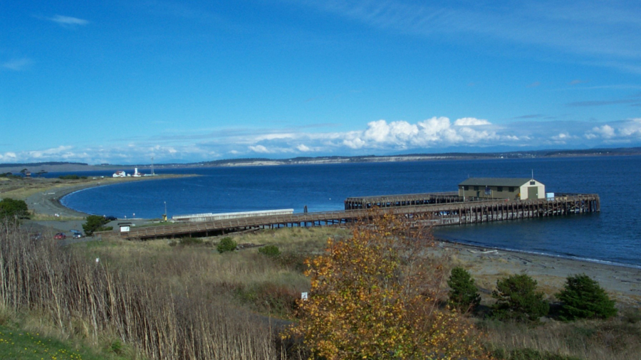 Fort Worden State Park's pier, beach, and lighthouse in the distance