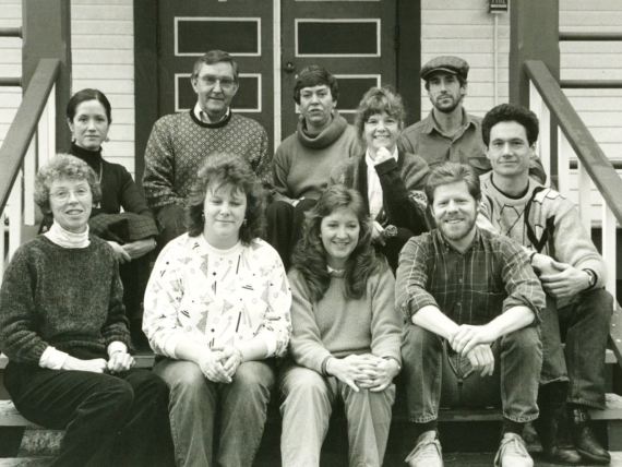 Black and white photo of Centrum Staff,sitting on the front porch of building 223.