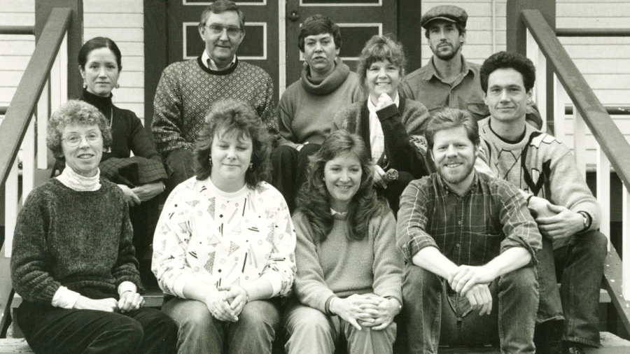 Black and white photo of Centrum Staff,sitting on the front porch of building 223.